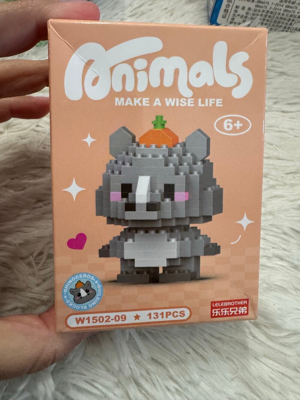 Cute rhinoceros with a pumpkin on head building block set with 131 pieces